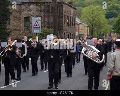 Brass band players march through Greenfield during the annual Saddleworth Whit Friday Band Contest. Stock Photo