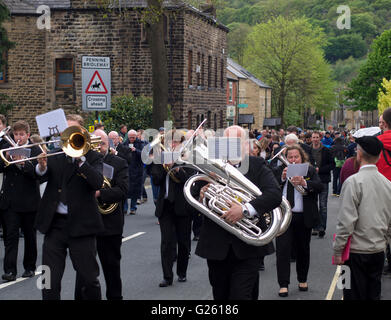 Brass band players march through Greenfield during the annual Saddleworth Whit Friday Band Contest. Stock Photo