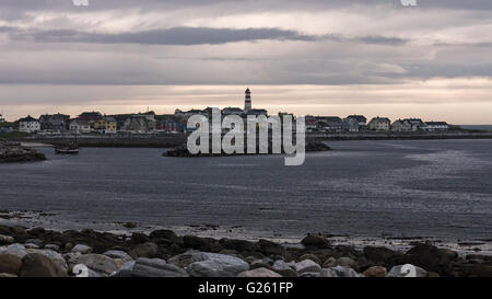 Alnes a fishing community at Godøy, Sunnmøre, Norway, harbouring one of Noway's most visited light houses. Stock Photo