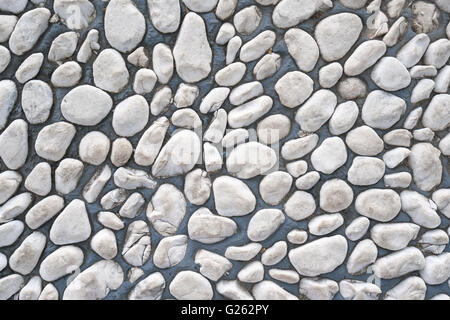 White pebble stone cemented floor, texture background Stock Photo