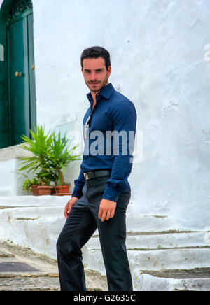 Portrait of handsome bearded man wearing elegant clothes and looking at camera Stock Photo