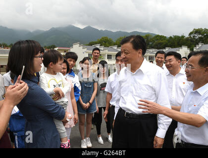 Beijing, China's Guangdong Province. 22nd May, 2016. Liu Yunshan (2nd R front), a member of the Standing Committee of the Political Bureau of the Communist Party of China Central Committee, talks with villagers of Wushiling Village in Ruyuan Yao Autonomous County, south China's Guangdong Province, May 22, 2016. Liu made an inspection tour in Guangdong from May 21 to 23. © Xie Huanchi/Xinhua/Alamy Live News Stock Photo
