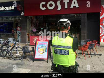Portsmouth, Hampshire, UK. 24th May, 2016. A couple this afternoon are recovering after a shop front in the busy Commercial Road in Portsmouth fell and knocked them to the ground outside the Costa Coffee. The middle-aged couple needed hospital treatment after a large piece of shop front fell to the ground and knocked them out.  One eye-witness, said, 'It was shocking. I was sat nearby when I saw the wood fall from the top and the couple collapsed  in a heap in the ground. Credit:  uknip/Alamy Live News Stock Photo