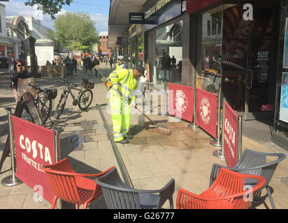 Portsmouth, Hampshire, UK. 24th May, 2016. A couple this afternoon are recovering after a shop front in the busy Commercial Road in Portsmouth fell and knocked them to the ground outside the Costa Coffee. The middle-aged couple needed hospital treatment after a large piece of shop front fell to the ground and knocked them out.  One eye-witness, said, 'It was shocking. I was sat nearby when I saw the wood fall from the top and the couple collapsed  in a heap in the ground. Credit:  uknip/Alamy Live News Stock Photo