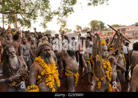 Ujjain, Madhya Pradesh, India, May 21, 2016: Holy Hindu Monks (Naga Sadhus) are going to take holy dip in the early morning in the scared river Shipra, also known as Kshipra on the concluding day of month long Simhasth Mahakumbh in ancient religious city Ujjain, India. Simhasth Kumbh Mahaparv is one of the four Kumbh Melas celebrated by largest spiritual gathering on Planet Earth. This year's Simhasth Kumbh Maha Parva is based on the celestial line-up of Planets and the Signs of the Zodiac, which occurs every 12 years. This year Simhasth Kumbh Mahaparv took place from April 22 to May 21. The c Stock Photo