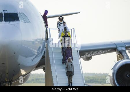 Helsinki, Finland. 24th May, 2016. Models displayed the latest collection during the Ultimate Runway Fashion Show at Helsinki Airport, Finland, on May 24, 2016. A unique fashion show was held on Tuesday night at the Runway 2 of Helsinki Airport, which was transformed into a catwalk and enabled seven designers from China, Korea, Japan, the UK, Sweden, Denmark and Finland to present their collections. © Sergei Stepanov/Xinhua/Alamy Live News Stock Photo