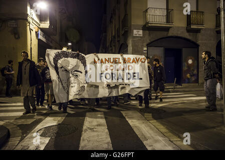 Barcelona, Catalonia, Spain. 25th May, 2016. Pro-squatter protesters march through Barcelona's Gracia quarter behind a banner showing the owner of the recently evicted former bank office after it has been used by squatters for the past years as an autonomous social-center Credit:  Matthias Oesterle/ZUMA Wire/Alamy Live News Stock Photo