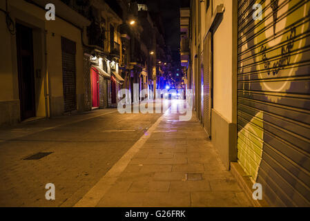 Barcelona, Catalonia, Spain. 25th May, 2016. Catalan riot police patrols the nightly streets of Barcelona's Gracia quarter as pro-squatter protesters demonstrate for the third night in row against the recent eviction of a former bank office after it has been used by squatters for the past years as an autonomous social-center Credit:  Matthias Oesterle/ZUMA Wire/Alamy Live News Stock Photo