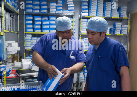 Theatre technicians check equipment in the linen storage room Stock Photo