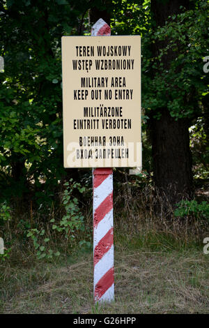 Military area keep out no entry sign in four languages: polish, english, german and russian Stock Photo