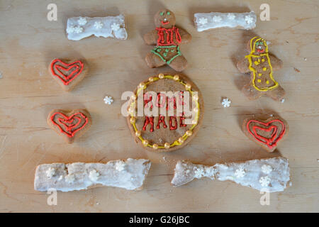 Different shape gingerbreads. Home made text on one of them. Stock Photo