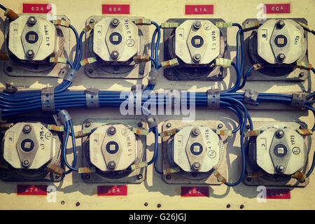 Old electrical metal control panel with switches. Stock Photo