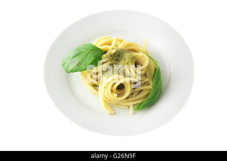 Spaghetti pasta with pesto sauce isolated on white background Stock Photo