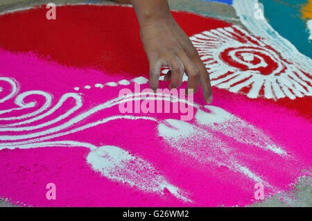 A lday drawing rangoli, Pune, Maharashtra, India Stock Photo