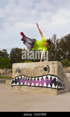 Parkour jump teenager in skate park Stock Photo