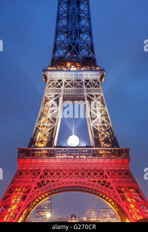 PARIS, FRANCE - NOVEMBER 20, 2015: Eiffel tower illuminated with colors of French national flag after November 13 Friday's terro Stock Photo