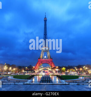 PARIS, FRANCE - NOVEMBER 20, 2015: Eiffel tower illuminated with colors of French national flag after November 13 Friday's terro Stock Photo
