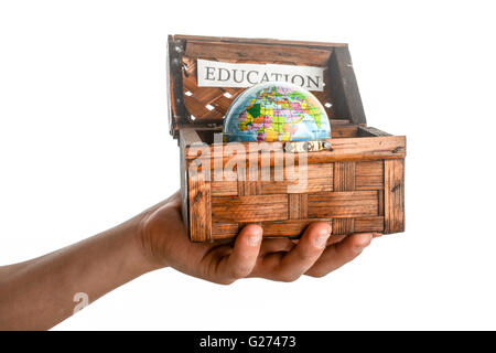 education sign and a globe in a chest box on a white background Stock Photo