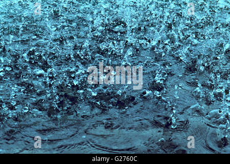 raindrops on water as background Stock Photo