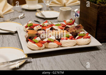 Cookie fruit tarts on dessert plate at a hotel chain - USA Stock Photo