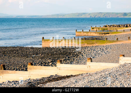 Sea defenses at Aberaeron, Wales, UK. Groynes protecting the shoreline. Stock Photo