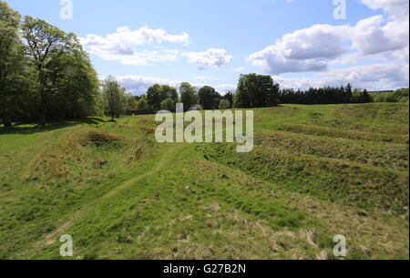 Remains of ditches and ramparts and access road to Ardoch Roman Fort near Braco Scotland  May 2016 Stock Photo