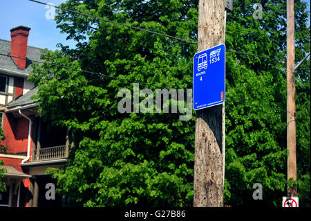 A blue bus stop sign in London, Ontario in Canada. Stock Photo