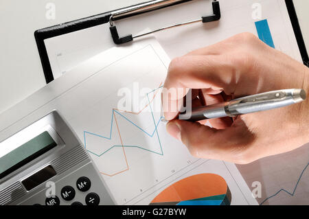 analyzing a person to chart on paper Stock Photo