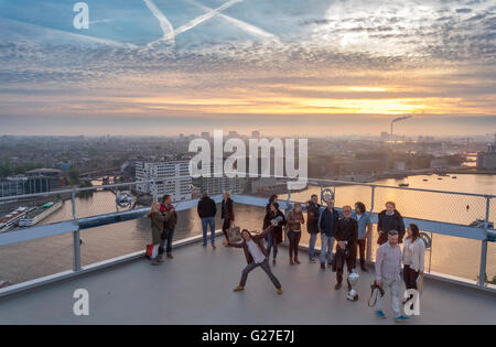 Amsterdam ADAM Lookout Tower observation deck at sunset. View towards western docklands from Amsterdam Noord. A'dam Toren. Stock Photo