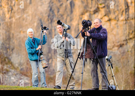 Birdwatchers at Warton Crag Quarry in the Arnside–Silverdale Area of Outstanding Natural Beauty Lancashire Stock Photo