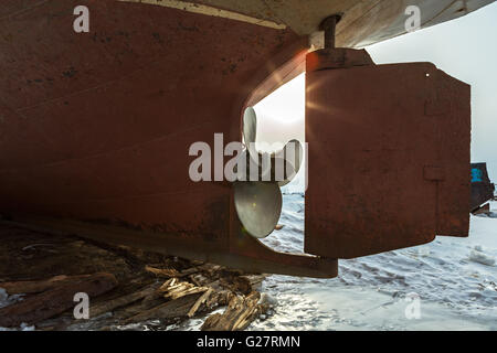 Screw the ship on background of the suns rays. Stock Photo