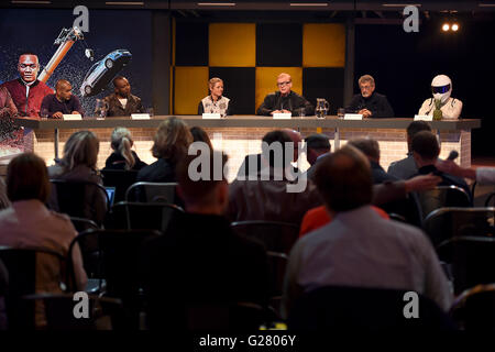 Top Gear presenters (left to right) Chris Harris, Rory Reid, Sabine Schmitz, Chris Evans, Eddie Jordan and The Stig, answer media questions during the launch of the car show at Dunsfold Aerodrome in Surrey, which returns to BBC Two on May 29 at 8pm. Stock Photo