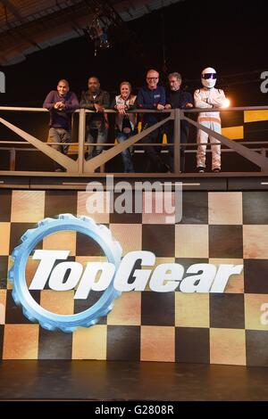 Top Gear presenters (left to right) Chris Harris, Rory Reid, Sabine Schmitz, Chris Evans, Eddie Jordan and The Stig, during the launch of the car show at Dunsfold Aerodrome in Surrey, which returns to BBC Two on May 29 at 8pm. Stock Photo