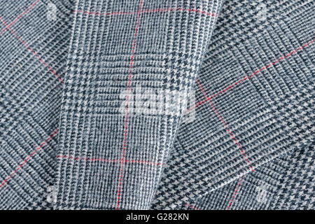 Glen plaid or Glenurquhart check a woolen fabric with a woven twill design of small and large checks used in suits and jackets Stock Photo