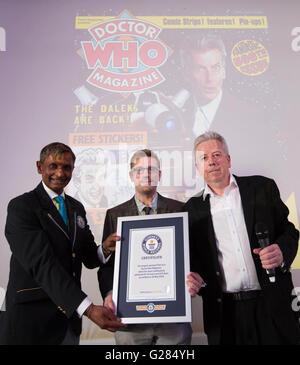 EDITORIAL USE ONLY (left to right) Guinness World Records adjudicator Pravin Patel presents Tom Spilsbury, Editor of Doctor Who Magazine and Mike Riddell, UK Managing Director of Panini with the Guinness World Record for The World's Longest Running TV-Tie in Magazine at a party to celebrate the 500th issue of the Doctor Who Magazine at White Space in London. Stock Photo