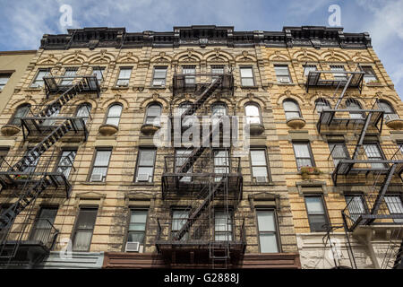 Fire stairs on a yellow brick building in Chelsea, New York Stock Photo
