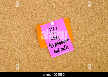 Business Acronym KPI Key Performance Indicator written on paper note pinned on cork board with white thumbtack, copy space available Stock Photo