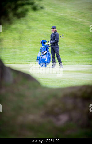 WENTWORTH, UK: May, 25, 2016 Tommy Fleetwood plays in the BMW PGA Celebrity Pro-Am, ahead of the Championship at Wentworth. Stock Photo