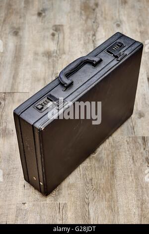 A studio photo of an old leather briefcase Stock Photo