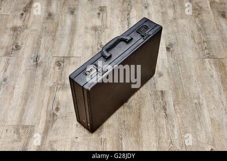 A studio photo of an old leather briefcase Stock Photo