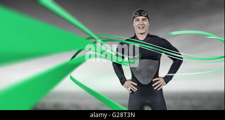 Composite image of portrait of confident swimmer in wetsuit