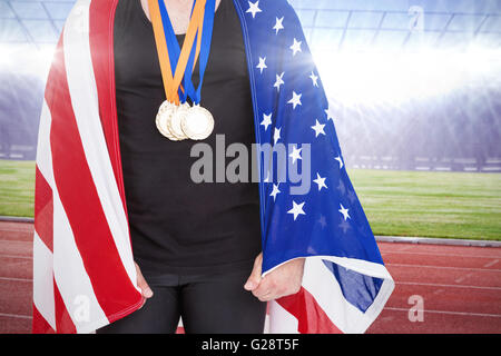 Composite image of athlete with olympic gold medal Stock Photo