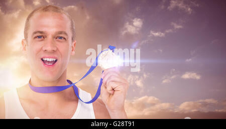 Composite image of close-up of athlete with olympic medal Stock Photo