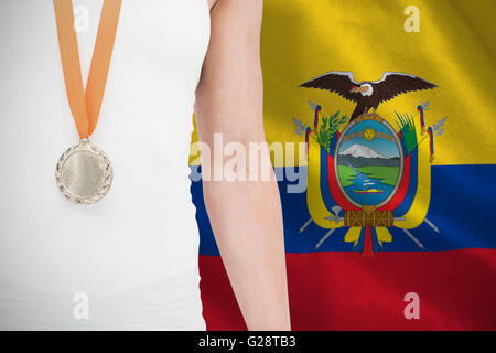 Composite image of female athlete wearing a medal Stock Photo