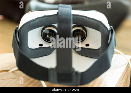 Virtual reality (VR) headsets (glasses) from behind. VR is immersive multimedia or computer-simulated reality - a computer techn Stock Photo