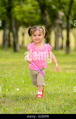 Kid playing in a city park Stock Photo