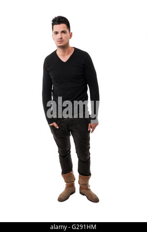 Handsome male model wearing a sweater and leather boots on a white background Stock Photo