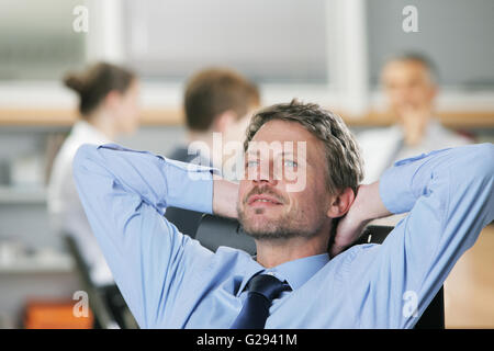 Portrait of a relaxed Businessman, business meeting on background Stock Photo