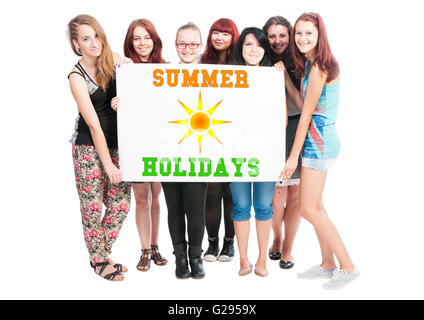 Summer holidays design illustration concept wrote on big white card hold by teen girls Stock Photo