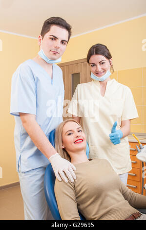 Confident dental team concept and beautiful woman patient Stock Photo